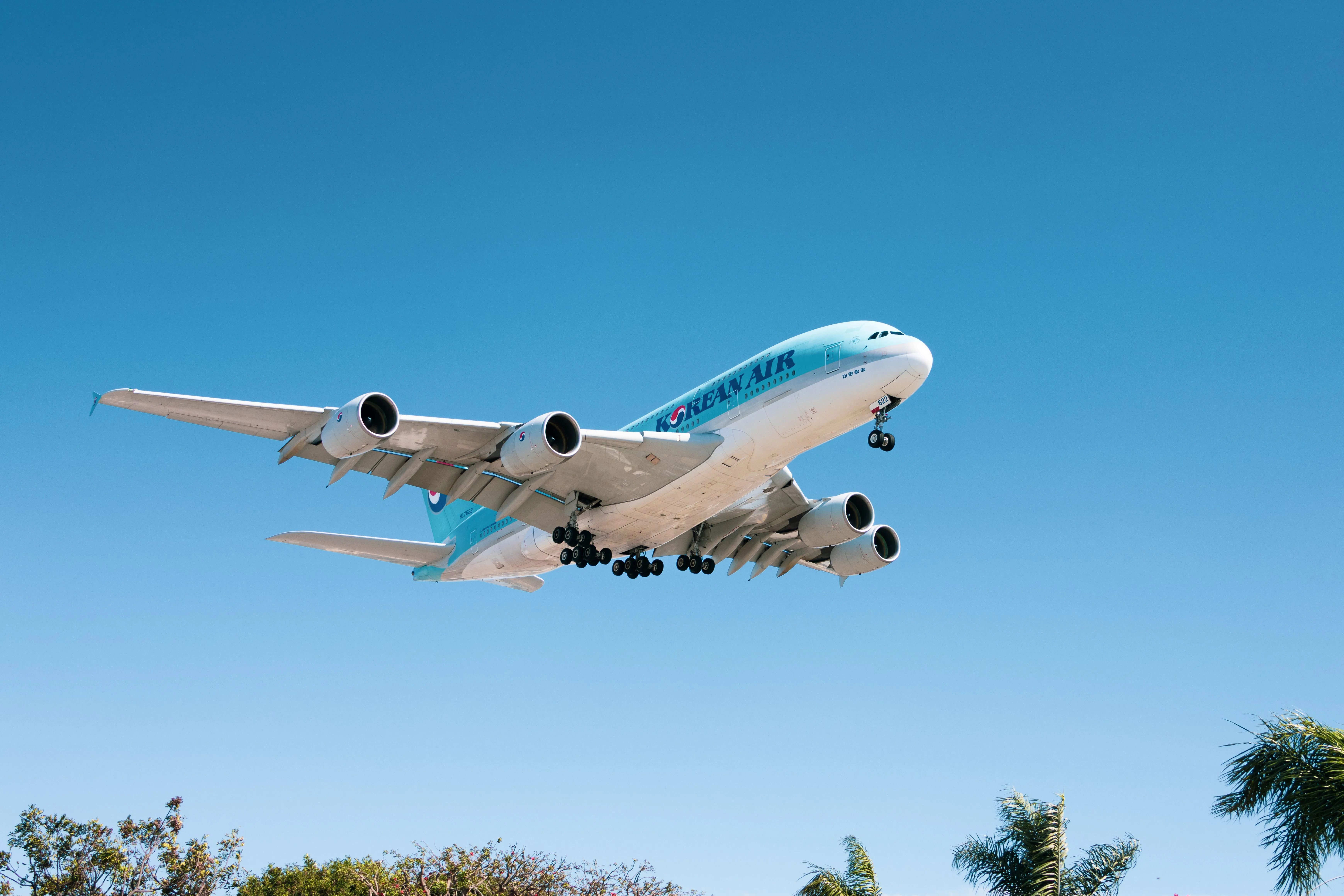 A Korean Air A380 on final approach against a clear blue sky